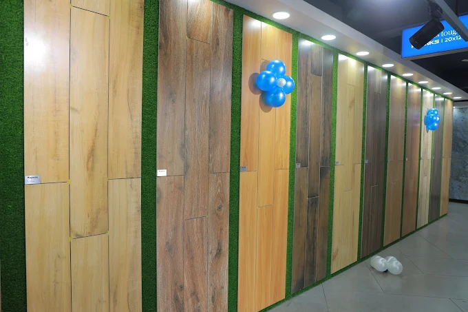 Vertical wooden-pattern tiles display - Premium Building Material Gallery at Karthika Granite & Sanitaryware